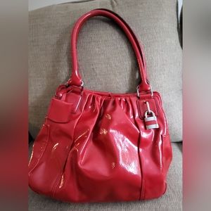 Worthington red purse with several sections about 12" long,10.5" High, 5.5" wide